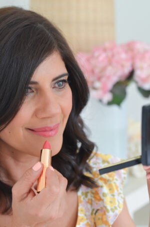 Desiree-Leone-with-Nordstrom-beauty-2021-wearing-Charlotte-Tilbuty-Lipstick-Coral-Kiss